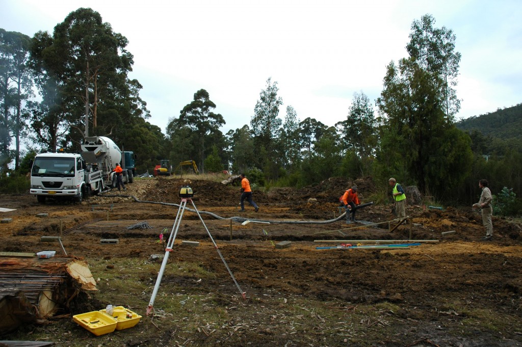 The stressful moment when the concrete pump gets blocked. The thing on the tripod is called a 'dumpy' and is used for getting levels on site