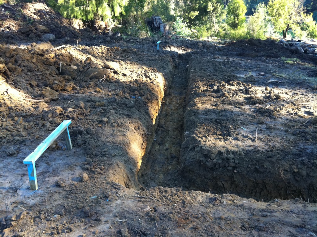 The strip footings dug with trestle on the left for the string line