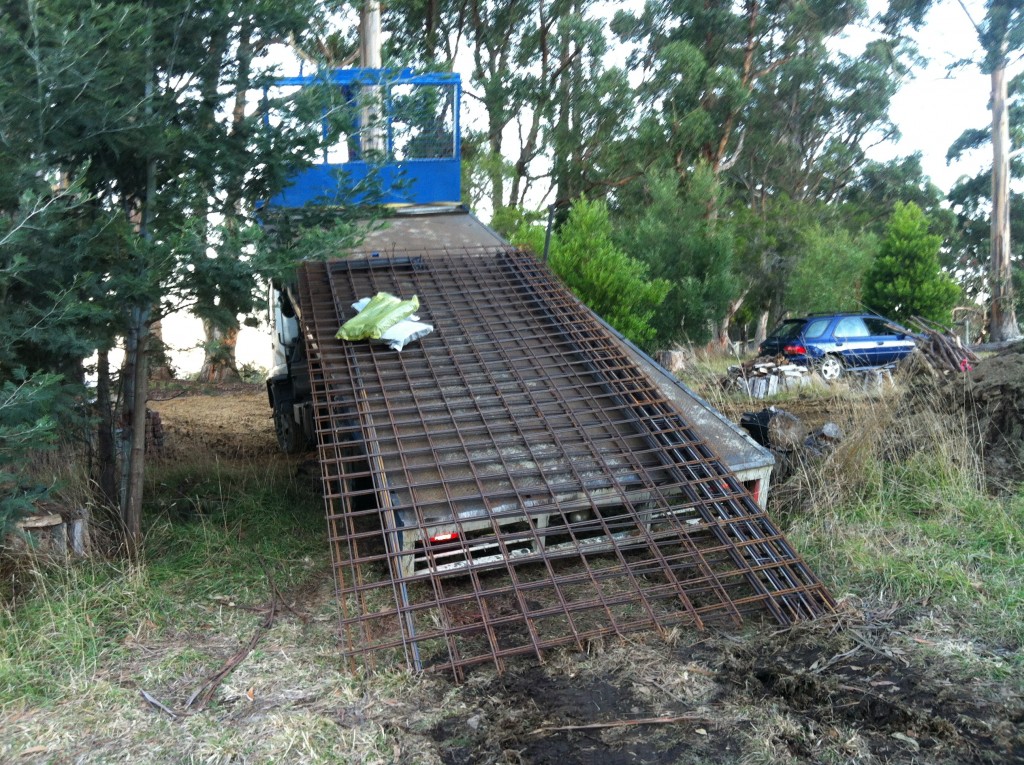 The first delivery truck - structural steel for the footings and slab