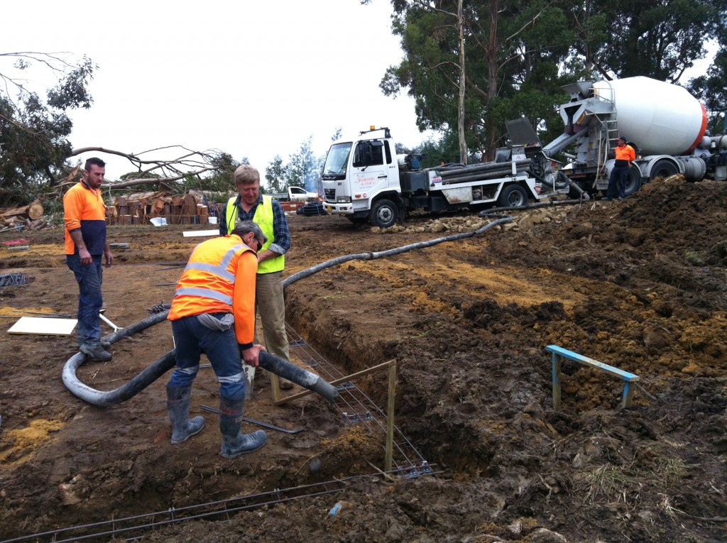 The first concrete is pumped into the footing