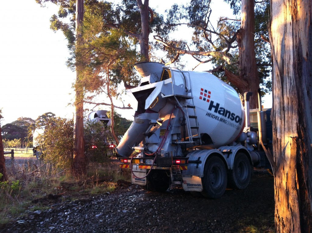 The morning of pouring the slab: one concrete truck waits for the other to leave