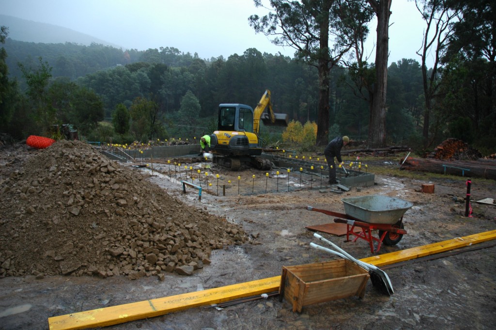 Preparing to fill: bailing out the water, removing the topsoil and knocking out the knock-out blocks