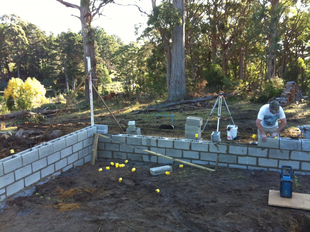 Scott laying the top course of blocks