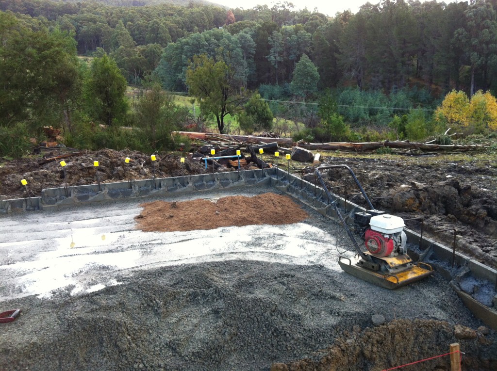 The 'whacker packer' sits silent as the sand waits to be spread across the FCR