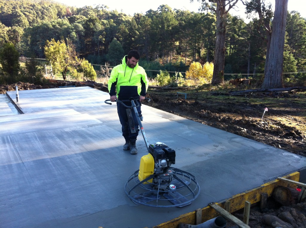 Flying solo: Stuart pilots the 'helicopter' - a mechanical tool for finishing concrete slabs