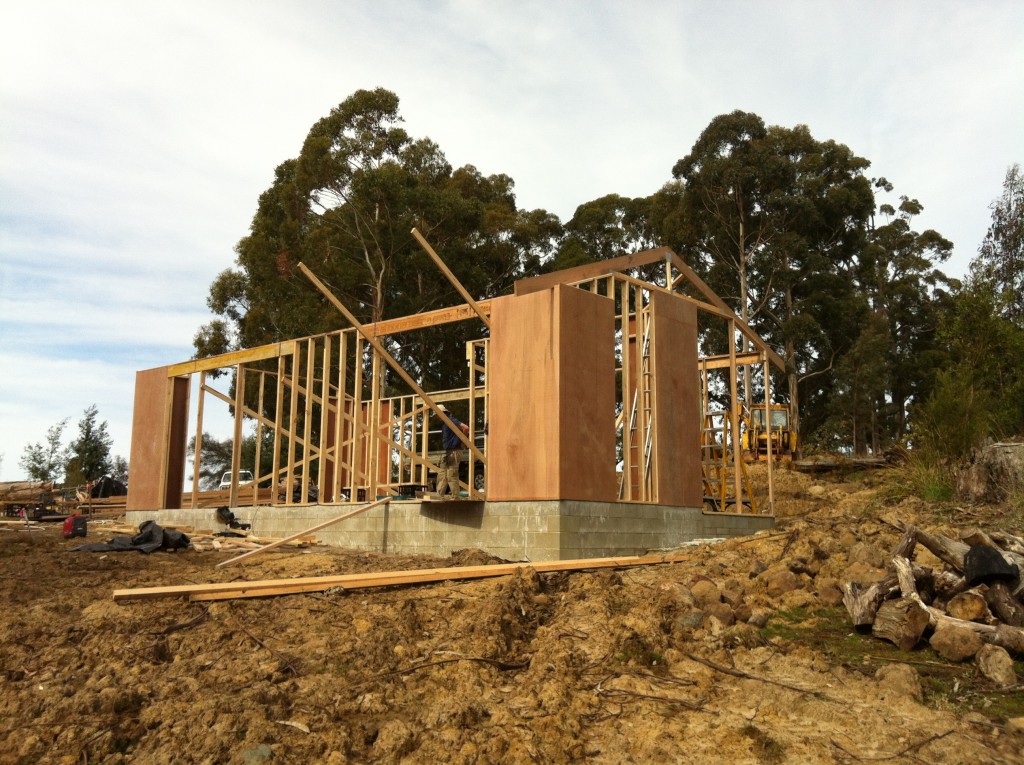 Really taking shape! The first truss in place - helps make the overall shape look less like a Quaker barn