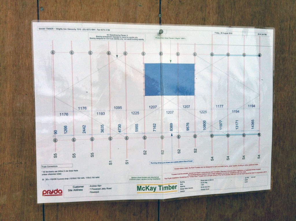 The roof truss and bracing plan, nailed to a wall for easy reference