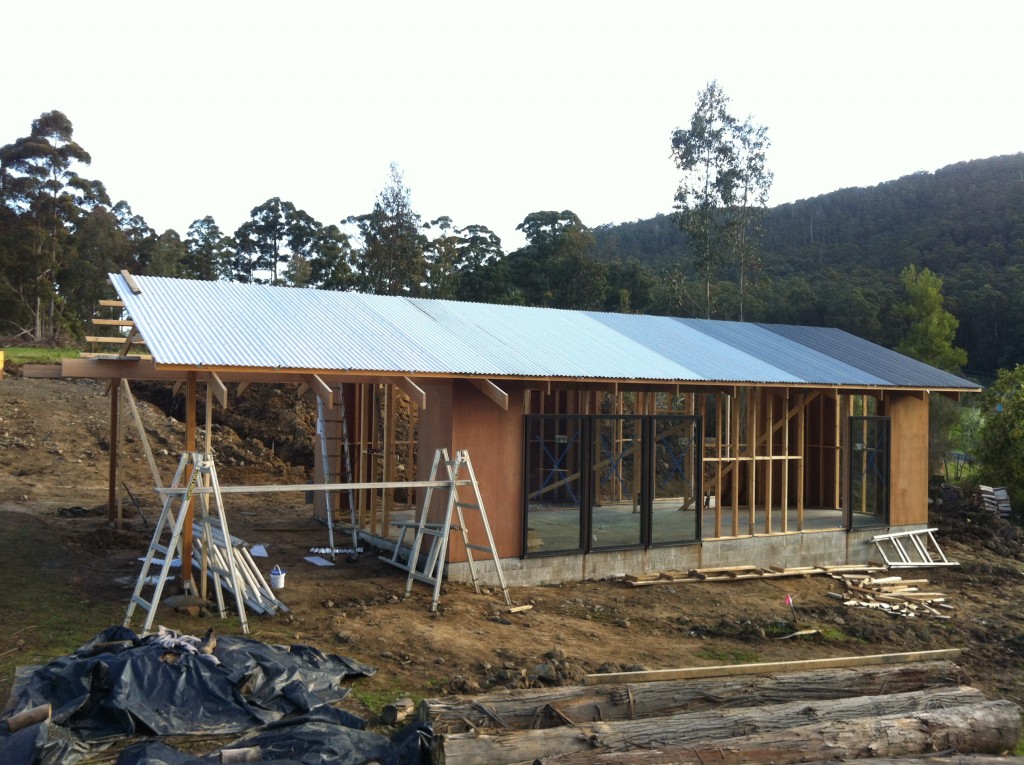 End of roofing day 1: half of the roof in place