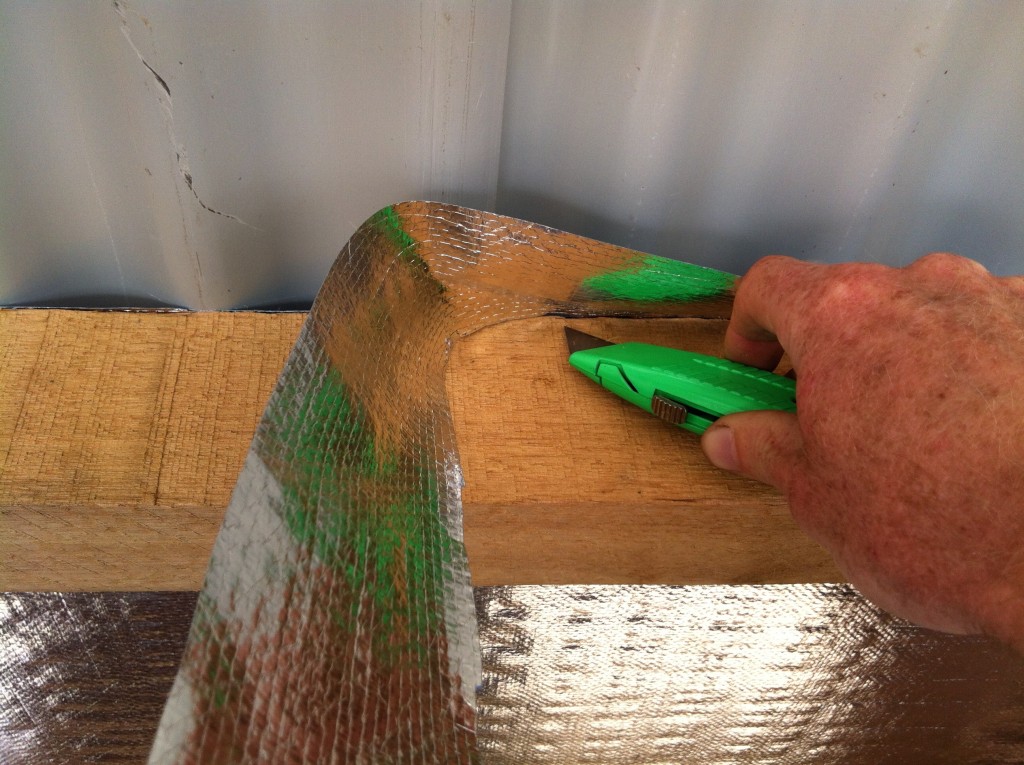 Trimming the excess roofing sisalation