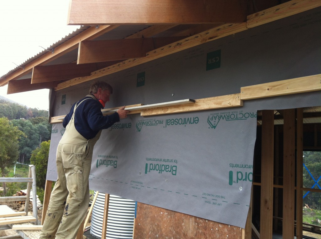 On the level: evening out the timber battens prior to fixing the cement sheet cladding