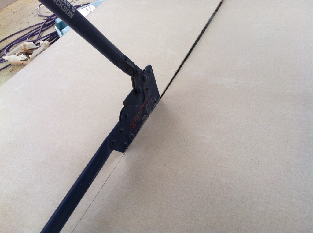 The cement sheet is easily cut with this hand tool