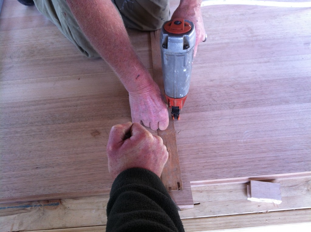 Nailed it: nailing the floor boards in place