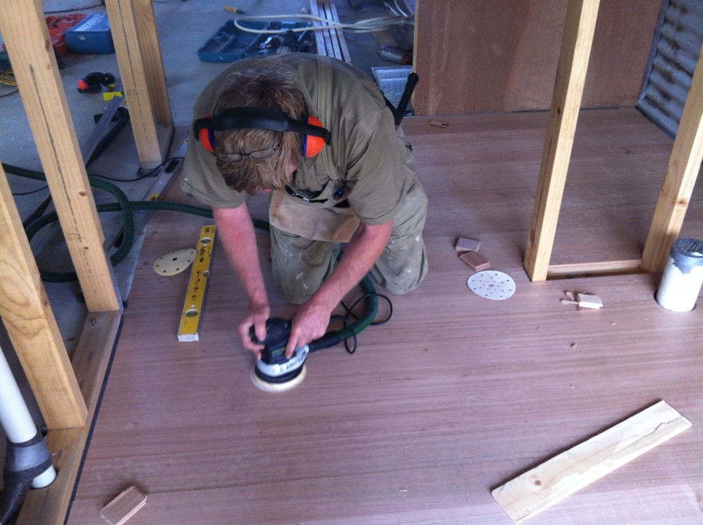 Smooth operator: sanding the floor boards for a smoother finish