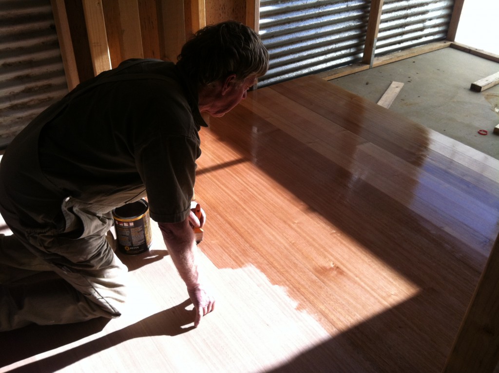 Shiny and new: Greg applying the first coat of the wax