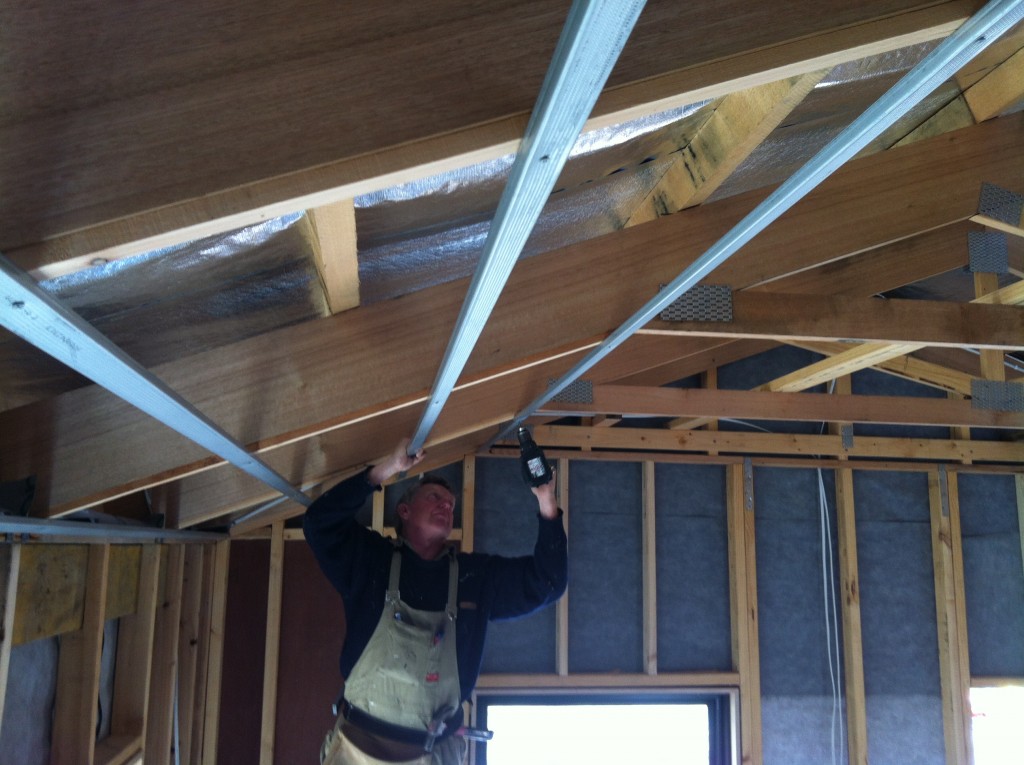 Greg fixing the furring channel for the plasterboard