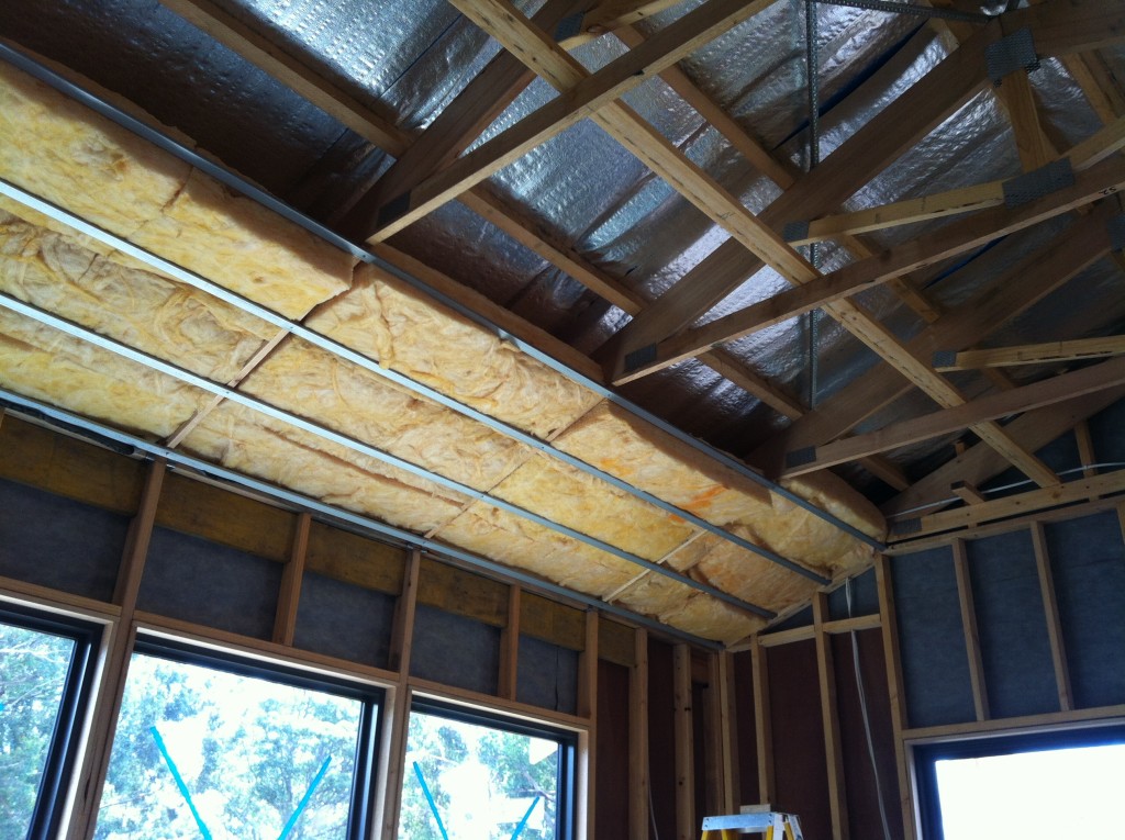 Packed to the rafters: the ceiling insulation held in place by the furring channel