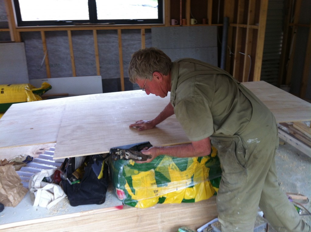 Plane sailing: Greg using a hand plane to aris the edges of the plywood sheets to conceal any inconsistencies along the edges