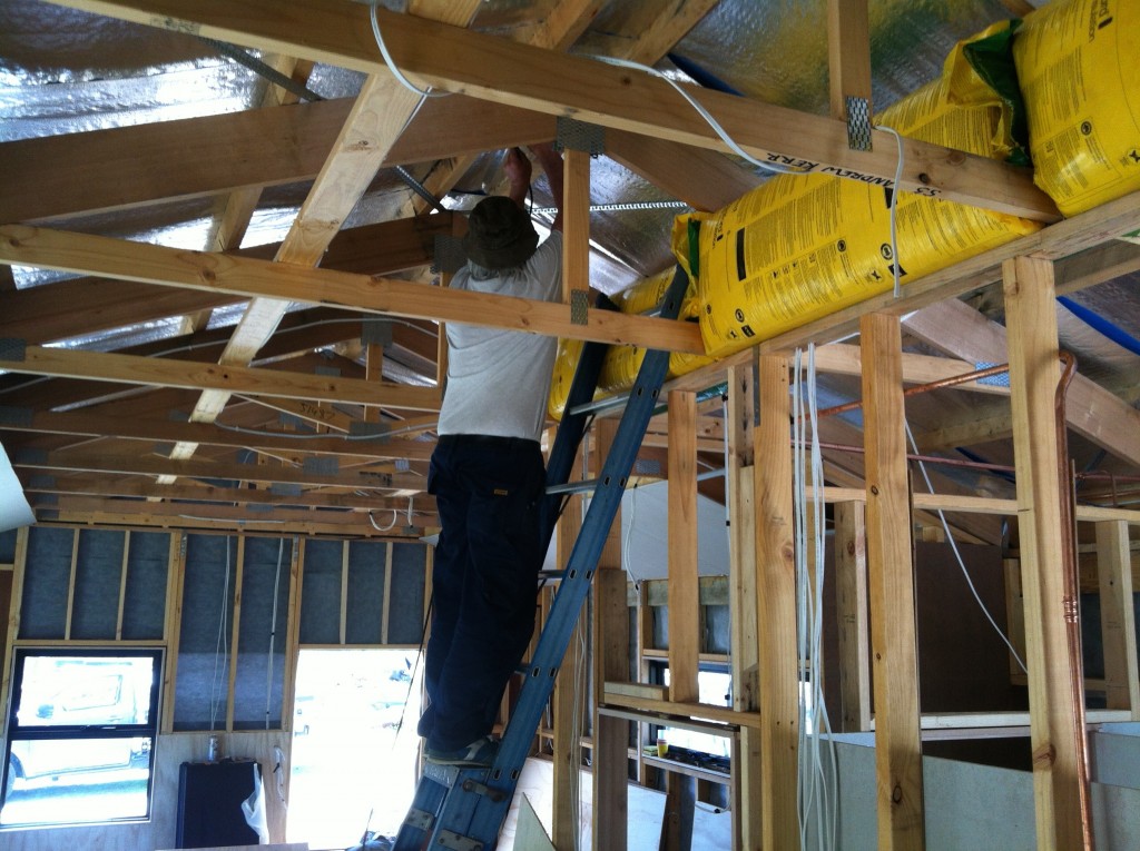 Coming down: pulling the coaxial cable down from the aerial through the roof