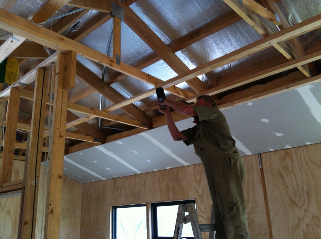 More battens: Greg fixing the ceiling battens to hold the flat plywood ceiling