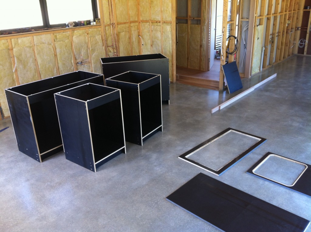 Kit of parts: the kitchen units and the tops, ready for assembly