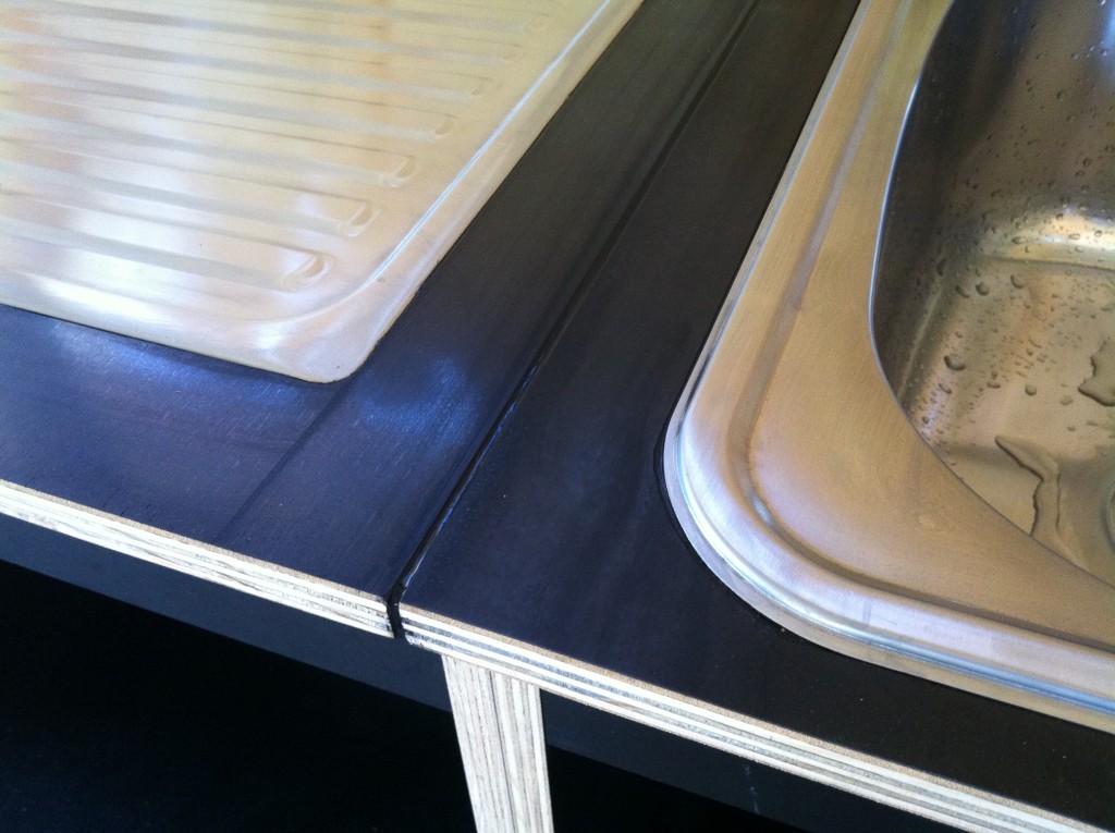 Attention to detail: the black sealant between the joins in the bench tops and around the flush edges of the sink and trough