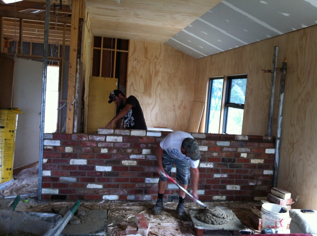 Taking shape: Scott shoveling mortar onto the boards