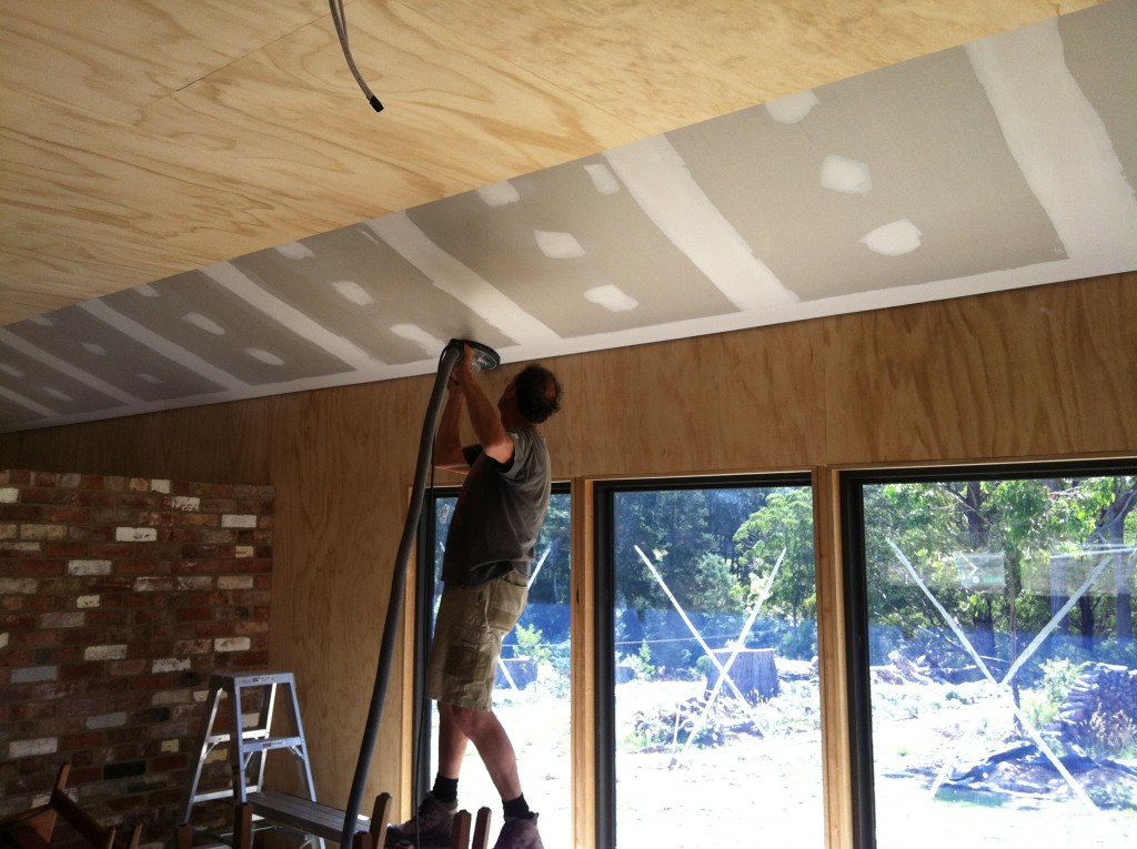 Dusty: Pete finishing the sanding of the plasterboard