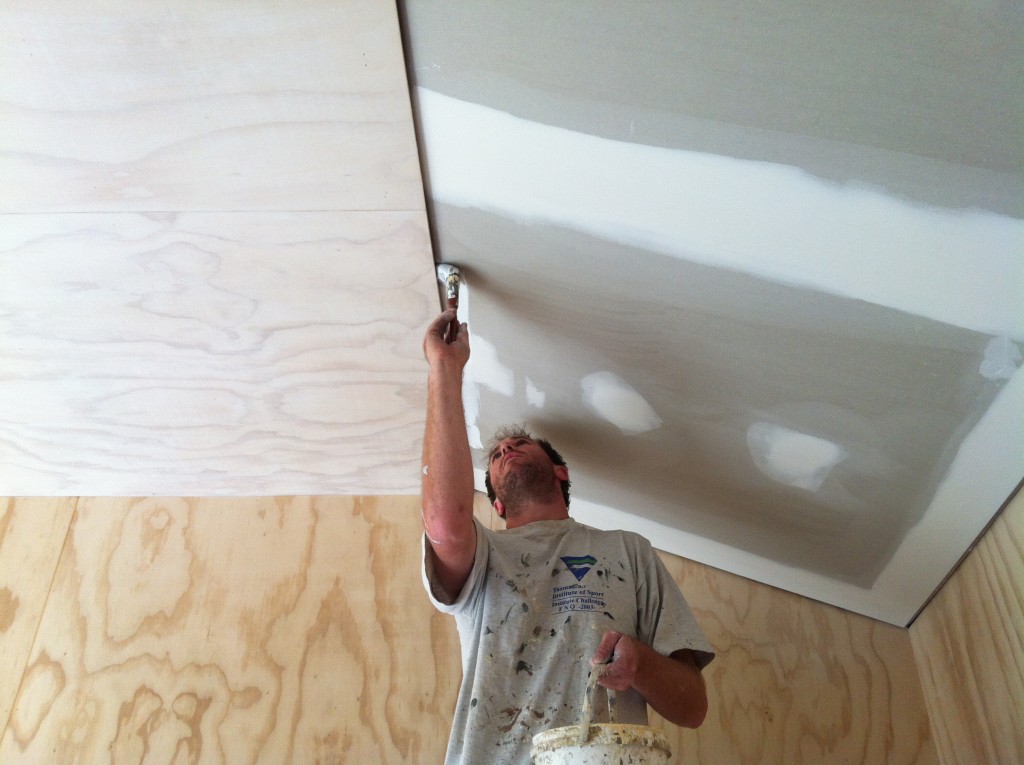 Cut shot: Gordon cutting in the edge of the plasterboard