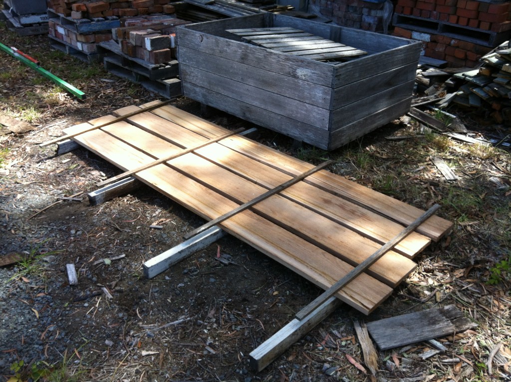 Start at the bottom: each layer of boards are separated by a thin timber rack stick