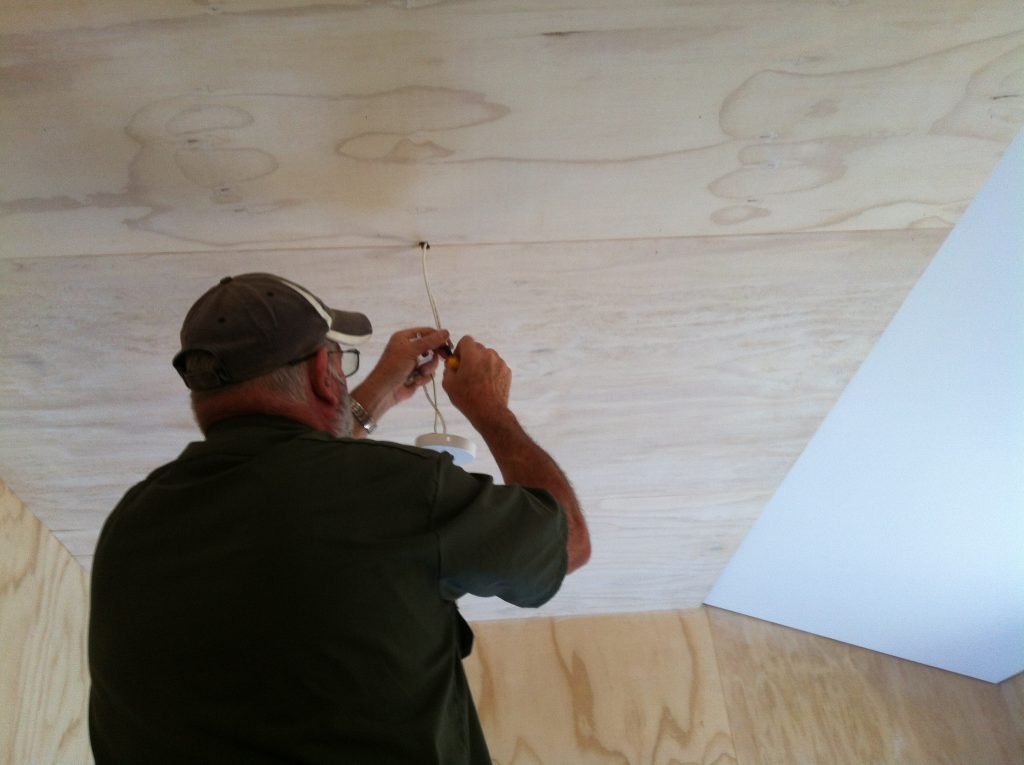 Sparky: Alan installing the bedroom light