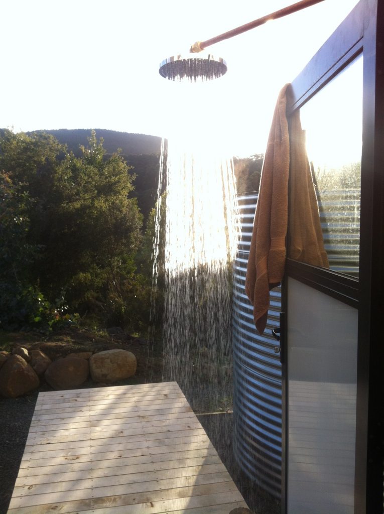 Hot stuff: running water for the outside shower in the late arvo sun