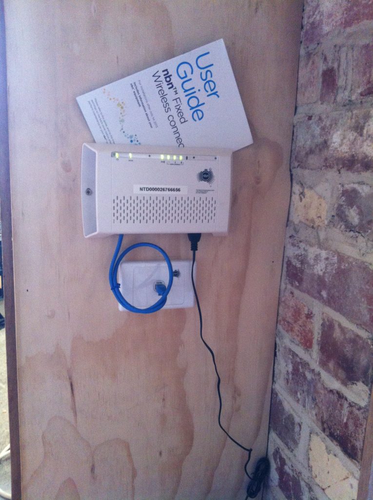 Perfect spot for it: the NBN box, complete with green lights!