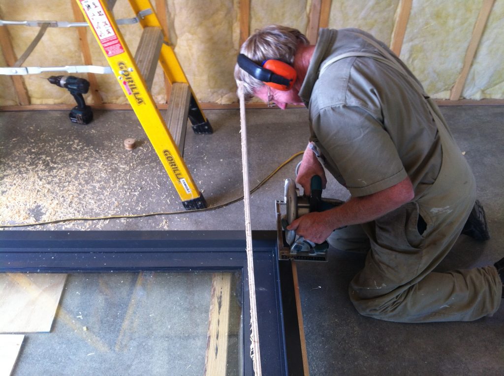 Like pulling good teeth - Greg going at the kitchen door with a circular saw