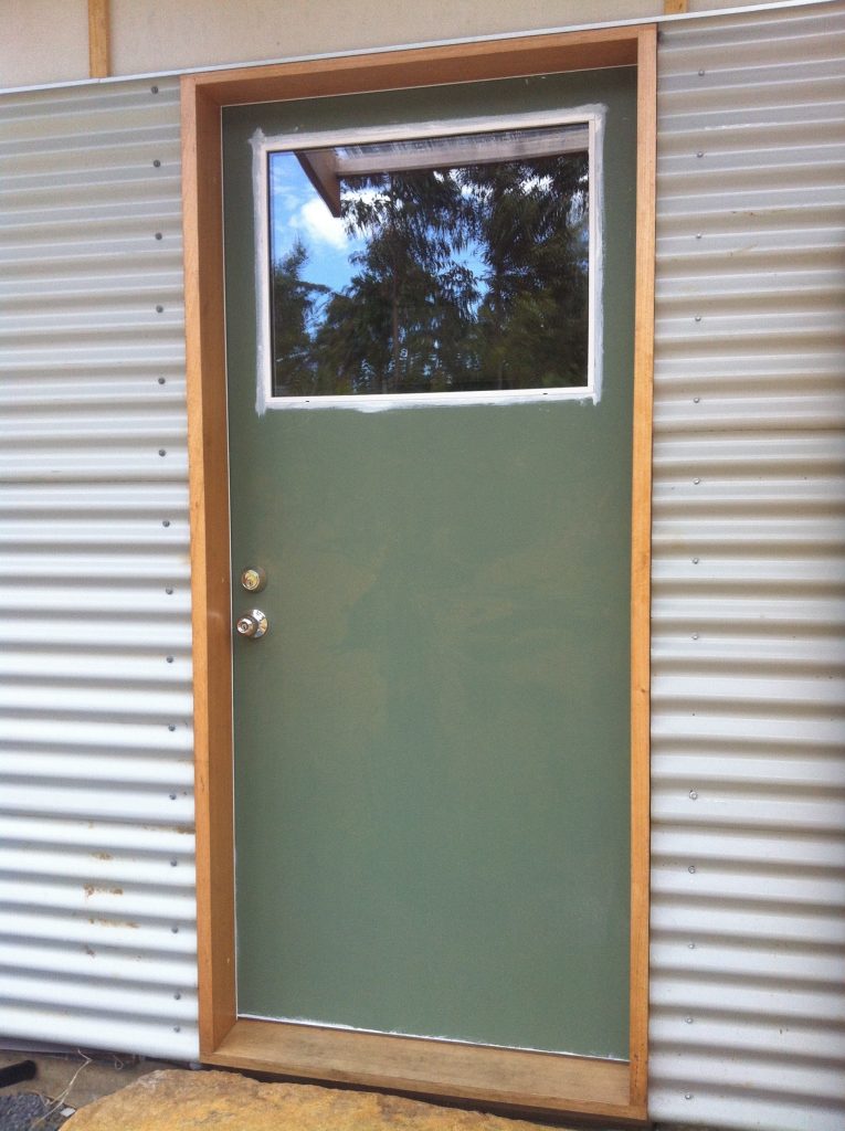 Welcome: the front door, minus its final coat of paint