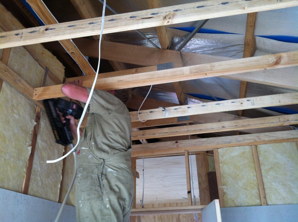 Hold on: Greg framing up the bathroom ceiling