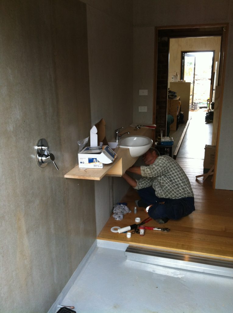 Plumb job: Ian connecting the vanity basin