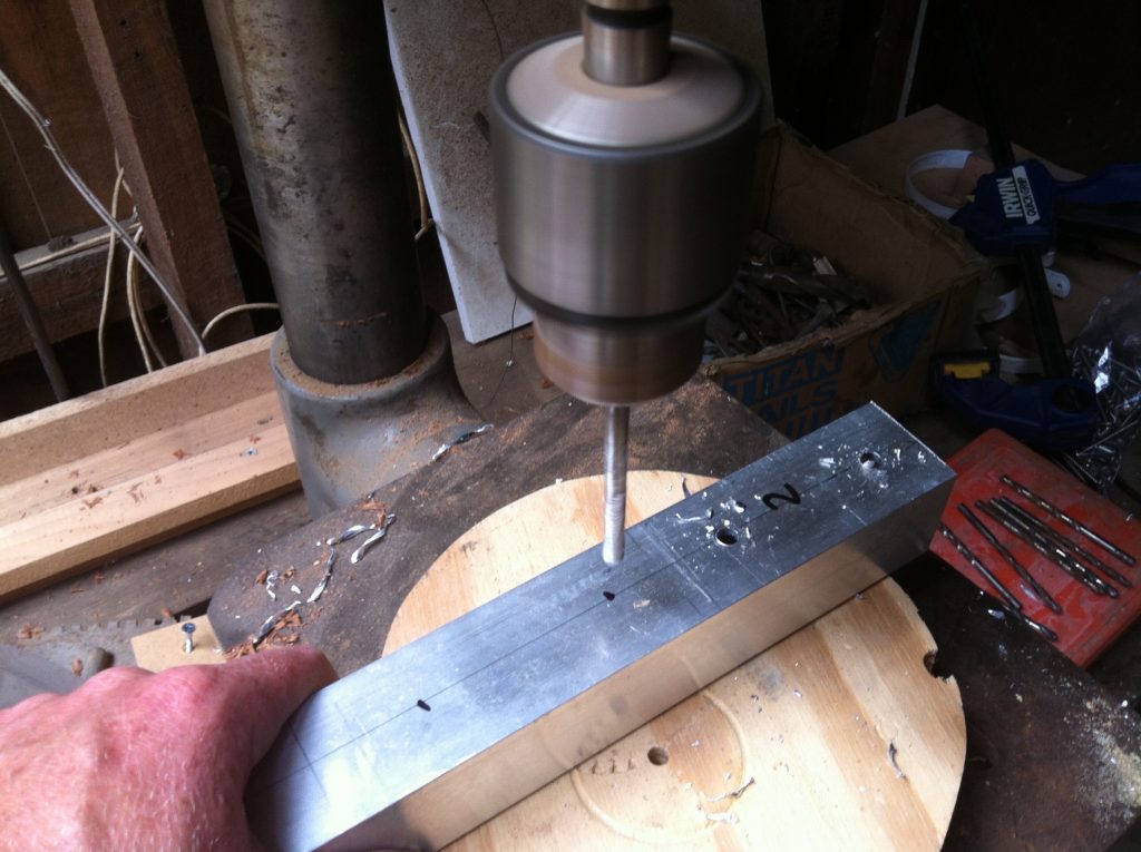 Press: using the drill press to pre-drill the aluminium